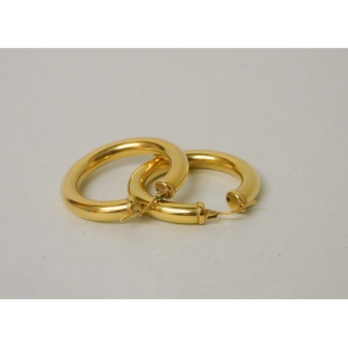 709 - A pair of Italian 18ct yellow gold large polished hoop earrings. Marked 750, gross weight 11.7g