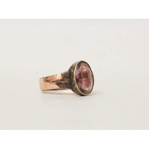 719 - A 9ct rose gold amethyst dress ring, hallmarked 9ct. Shank cut, ring size R, gross weight 3.5g