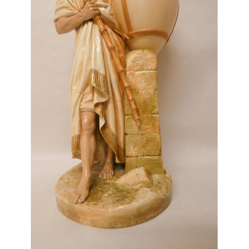 201 - A large Royal Worcester Blush Ivory figure of an African water carrier. 46cm tall