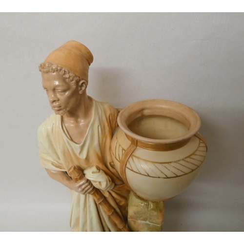 201 - A large Royal Worcester Blush Ivory figure of an African water carrier. 46cm tall