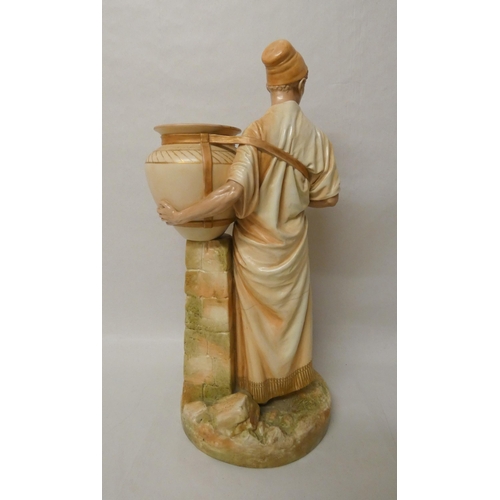 201 - A large Royal Worcester Blush Ivory figure of an African water carrier. 46cm tall