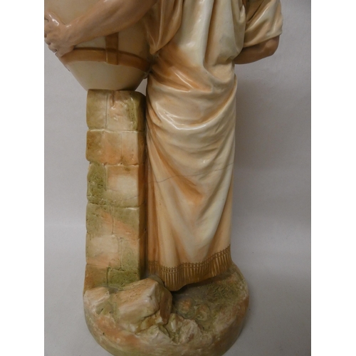 201 - A large Royal Worcester Blush Ivory figure of an African water carrier. 46cm tall