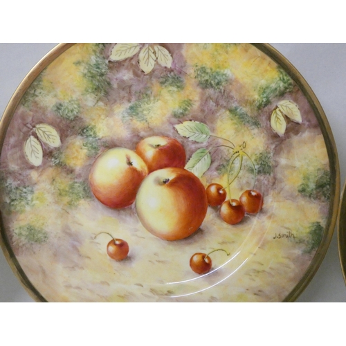 202 - A set of three Royal Worcester cabinet plates painted with autumnal fruits, signed J Smith