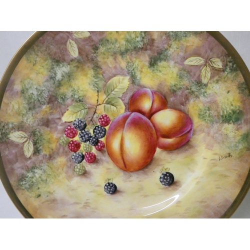 202 - A set of three Royal Worcester cabinet plates painted with autumnal fruits, signed J Smith