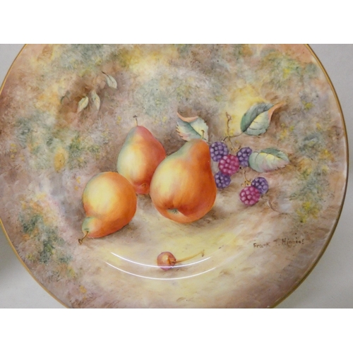 204 - A pair of Malvern bone china cabinet plates painted with pears, one signed Frank Higgins, the other ... 