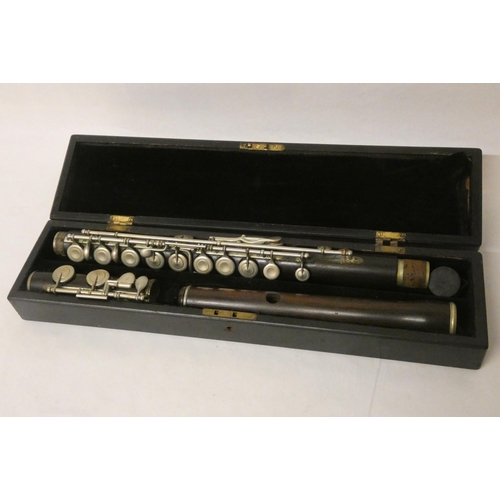 209 - A rosewood and silver plated mounted flute marked S Quilter, London in fitted case