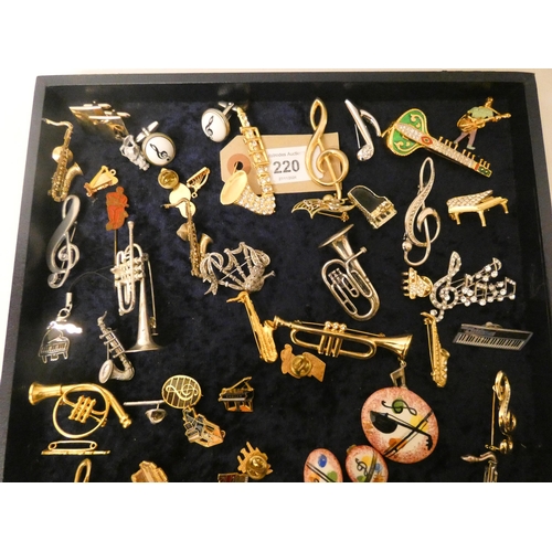 220 - A very large collection of musical themed brooches, cufflinks and miniature models of musical instru... 