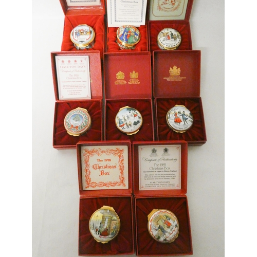 242 - A collection of eight Halcyon Days Christmas trinket boxes with original boxes