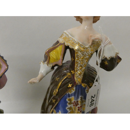 248 - Two Crown Derby porcelain figurines of a Gallant couple. Crown Derby marks to the bases