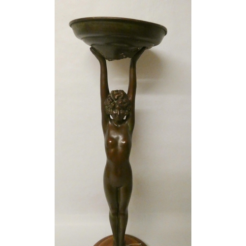 255 - Art Deco bronze comport modelled as a naked lady with arms raised supporting a dish, 26 tall