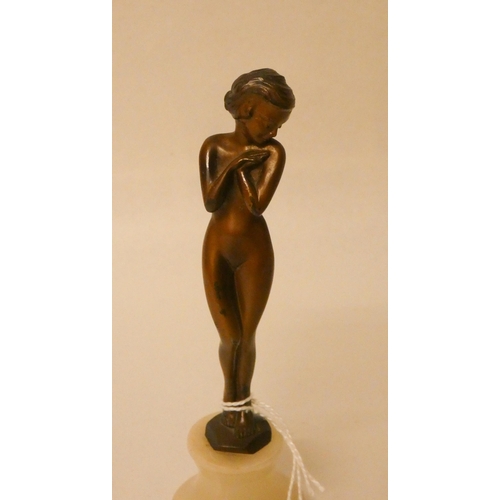 259 - An Art Deco bronze of a naked female, on circular onyx base. 6