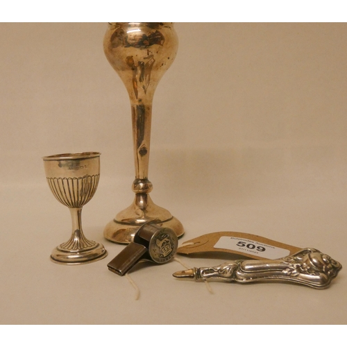 509 - A silver covered vase on weighted base, silver egg cup and a six pence mounted whistle etc