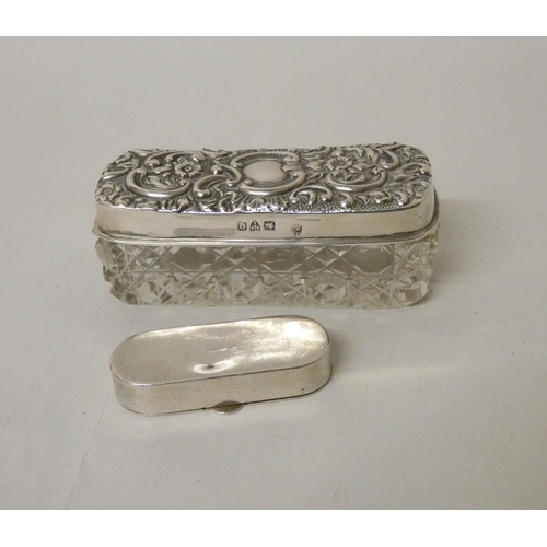 518 - A silver topped dressing table jar and a silver snuff box of oval form. 1.25 oz weighable silver