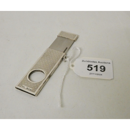 519 - A silver cigar cutter, with engine turned decoration, Birmingham hallmarks.