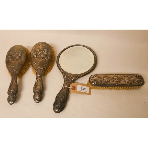 528 - A four piece Gainsborough cherub decorated silver backed hairbrush and dressing table hand mirror se... 