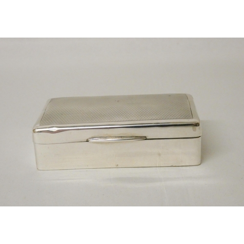 538 - A silver engine turned rectangular box, with hinged lid. 8.7 cms across