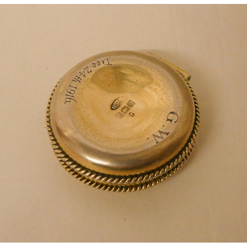 539 - A circular silver gilt communion trinket box, Hallmarked 1913, inscription dated 1916