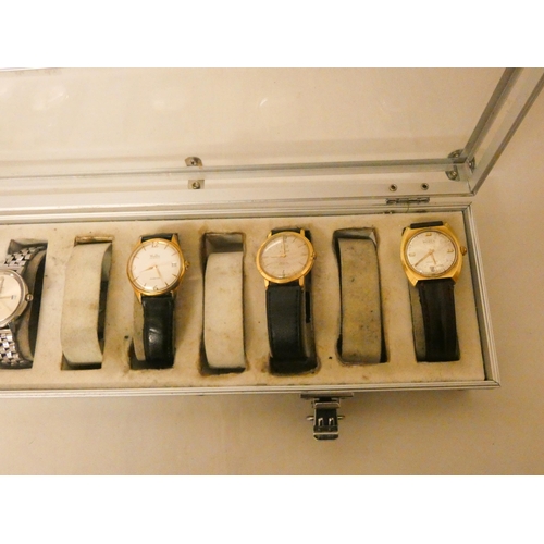 555 - A watch case and a collection of seven  vintage gents wristwatches to include Rotary, Vulcain, Borel... 