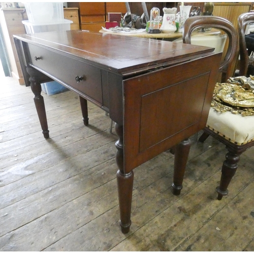 133 - A Victorian style mahogany side table fitted one long drawer with drop leaves standing on turned leg... 