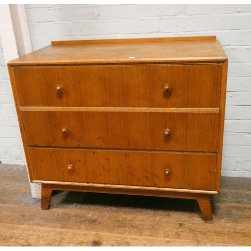 196 - A 1950's light oak chest of three long drawers, 3' wide