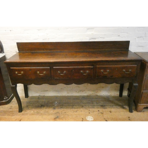 383 - A long oak dresser base fitted three drawers with brass handles standing on cabriole style legs. 6'3... 