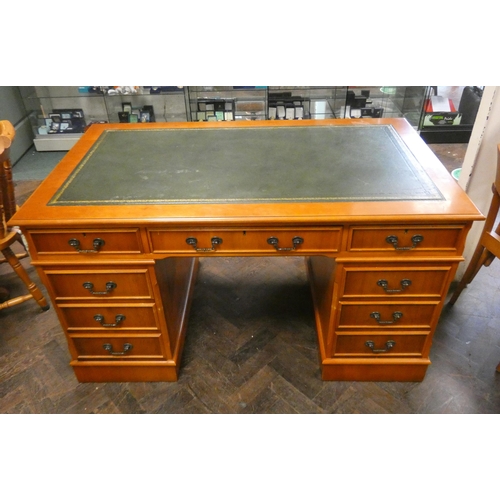 406 - A Georgian style yew wood twin pedestal desk fitted nine drawers with green leather top, 4'6