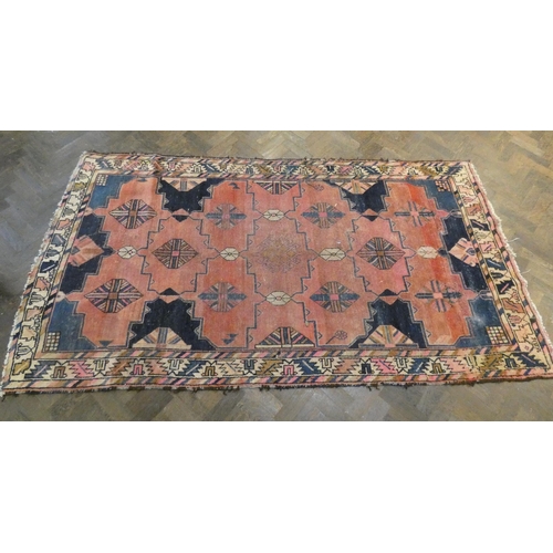 420 - Two large Persian style wool pile rugs, both worn