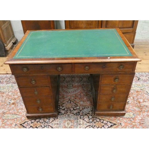 433 - A Victorian mahogany knee-hole office desk fitted ten drawers with circular brass handles and green ... 