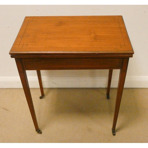 434 - An Edwardian lined inlaid satinwood folding top card table on square taper legs, 2' wide