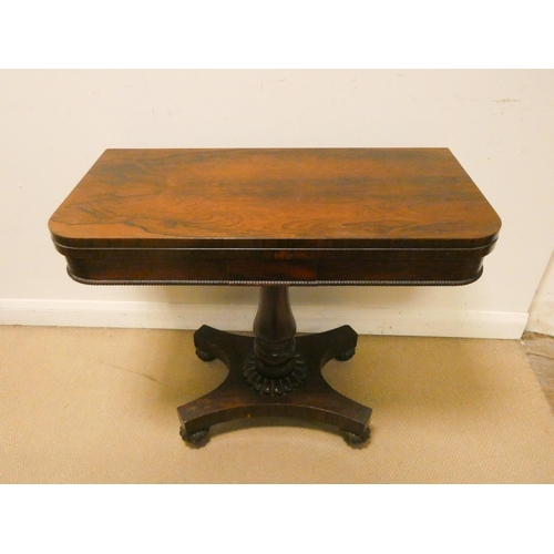 457 - An Victorian rosewood folding top card table on pillar and platform base, 3' wide