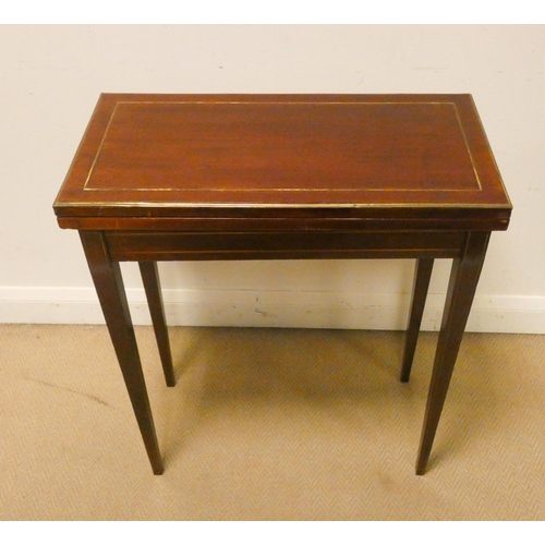 473 - A mahogany and brass lined inlaid folding top card table with red leather insert 25