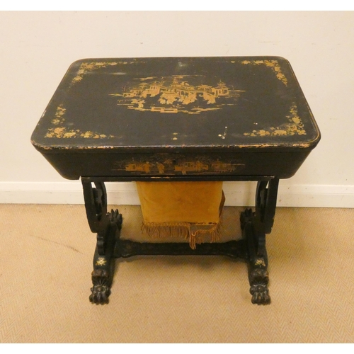 477 - A Victorian and black lacquered and gilt decorated workbox table with fitted interior standing on a ... 