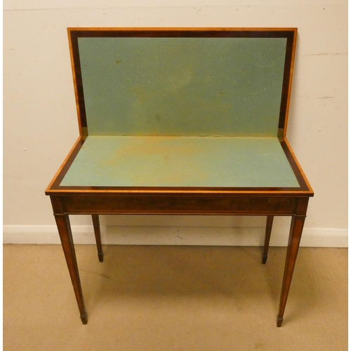 479 - An Edwardian inlaid mahogany folding top card table on square taper legs. 3' wide