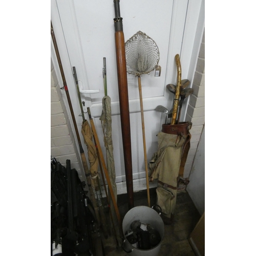 817 - A quantity of old fishing rods, fishing reels, rod rests, and a quantity of old golf clubs some with... 