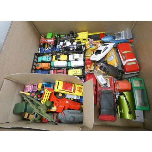 825 - A large box of played with model cars etc