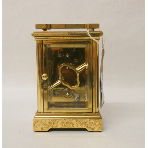 266 - A French gilt brass carriage clock with engraved carrying handle and case complete with key