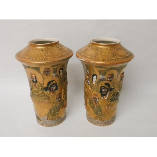 277 - A pair of Japanese Satsuma vases, relief moulded with figures against a gilt background. Gilt seal m... 