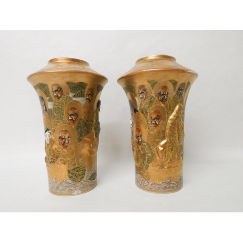 277 - A pair of Japanese Satsuma vases, relief moulded with figures against a gilt background. Gilt seal m... 