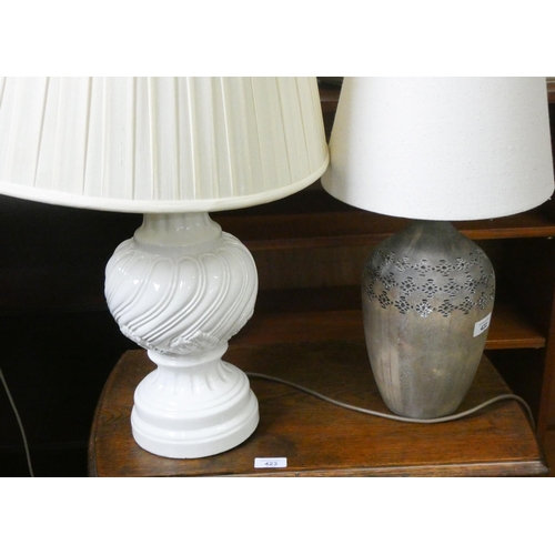 422 - A large cream china table lamp with shade and a smaller vase shaped table lamp with shade