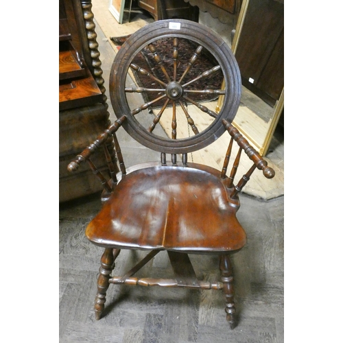 485 - An usual elm seated country chair comprising parts of an antique spinning wheel