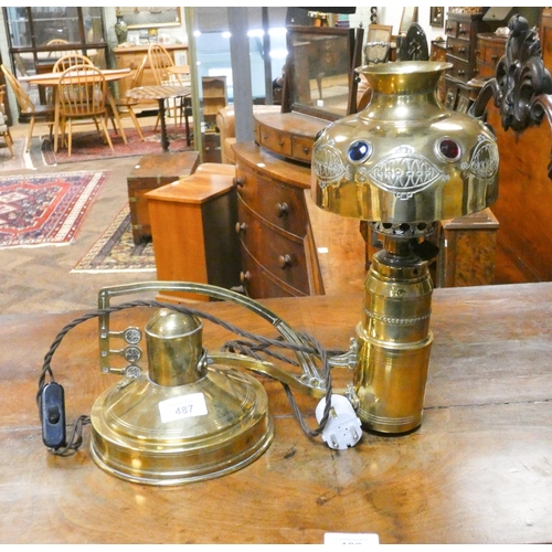 487 - An antique arts and crafts brass student lamp with inset cabochon decorative stones