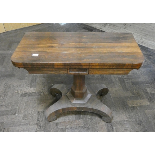 491 - A Victorian rosewood folding top card table on pillar and platform base, 3' wide