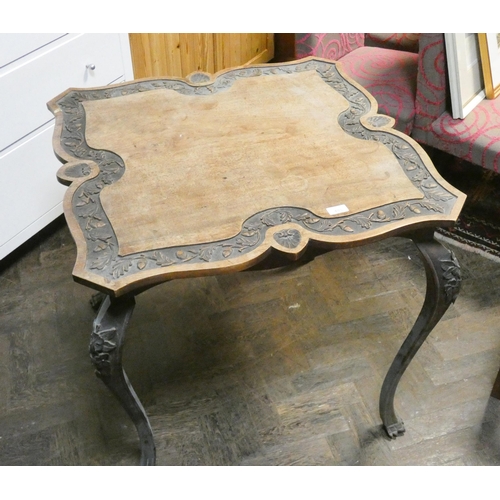 493 - A late Victorian mahogany shaped top centre table with acorn carved frieze and carved cabriole style... 