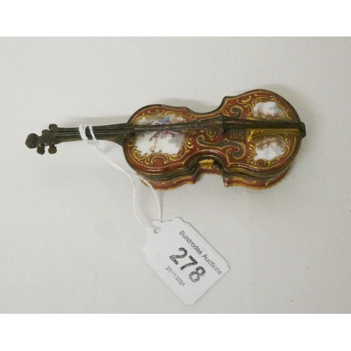 278 - An antique enamel trinket or snuff box, modelled as a cello. With gilt metal mounts, 12cms long