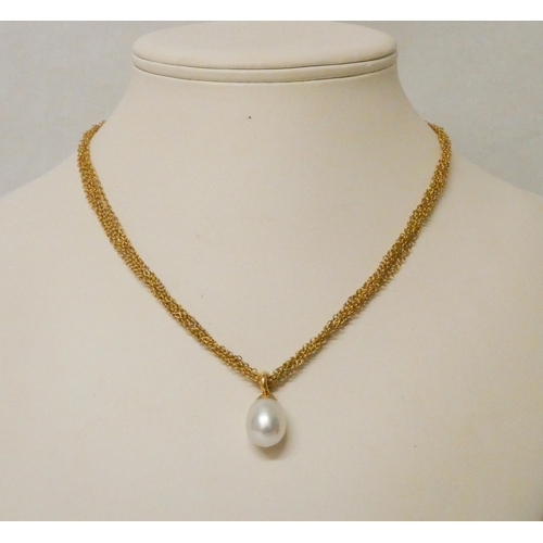 614 - Tiffany - a gold and pearl pendant necklace, large pearl suspended from a six strand mesh 18ct gold ... 