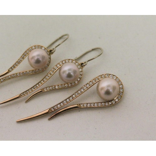 615 - Modern rose gold, diamond and pearl pendant and matching drop earrings, of elongated tear drop shape... 