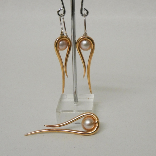 615 - Modern rose gold, diamond and pearl pendant and matching drop earrings, of elongated tear drop shape... 