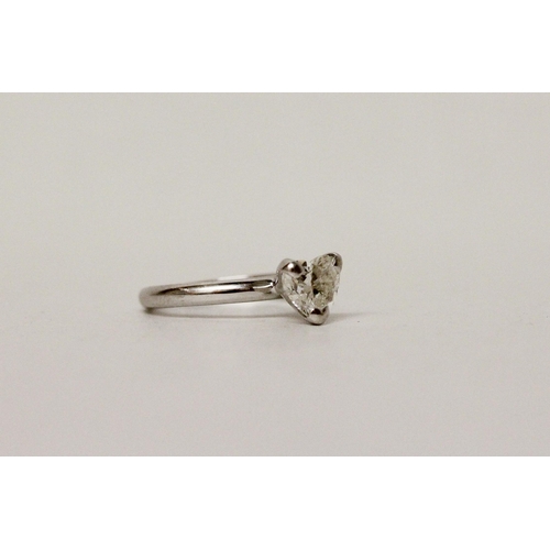 619 - A heart shaped diamond solitaire ring, the heart shaped diamond in claw setting, hallmarked band, di... 