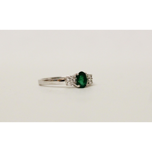 627 - An emerald and diamond ring, on hallmarked 18ct white gold band. Ring size N, 2.8g