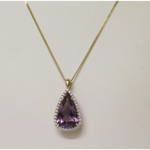 629 - A large amethyst and diamond cluster pendant, of modern triangular shape, on hallmarked 18ct yellow ... 